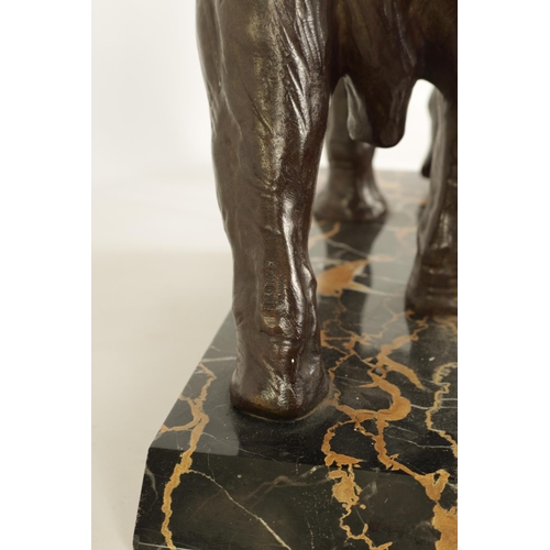 578 - A FRENCH ART DECO BRONZE SCULPTURE OF AN ELEPHANT mounted on a angled back marble base - stamped Bro... 