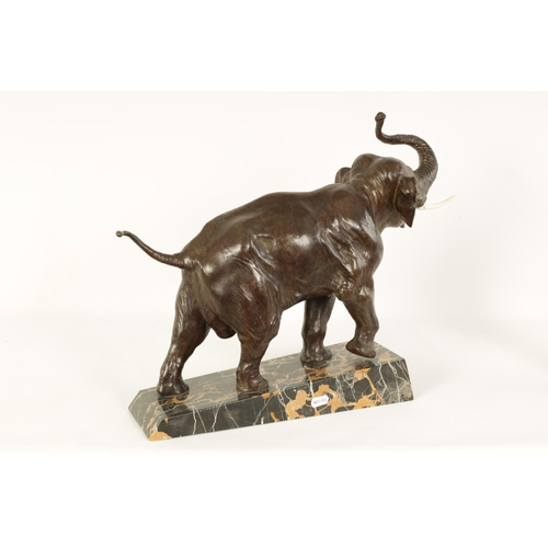 578 - A FRENCH ART DECO BRONZE SCULPTURE OF AN ELEPHANT mounted on a angled back marble base - stamped Bro... 