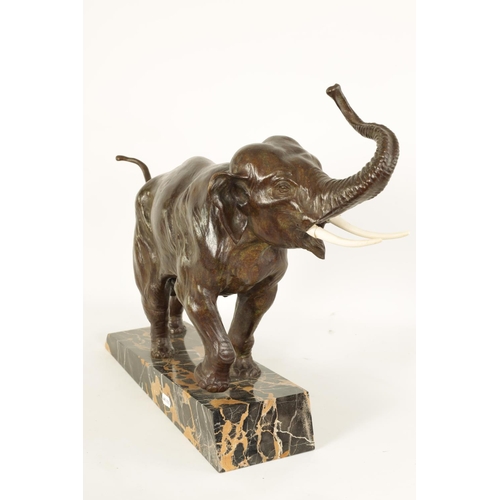 578 - A FRENCH ART DECO BRONZE SCULPTURE OF AN ELEPHANT mounted on a angled back marble base - stamped Bro... 