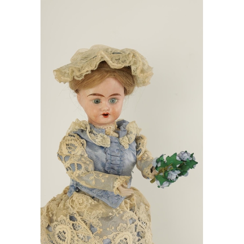 580 - A LATE 19TH CENTURY FRENCH MUSICAL AUTOMATON DOLL with moving bisque head and arms wearing a lacewor... 