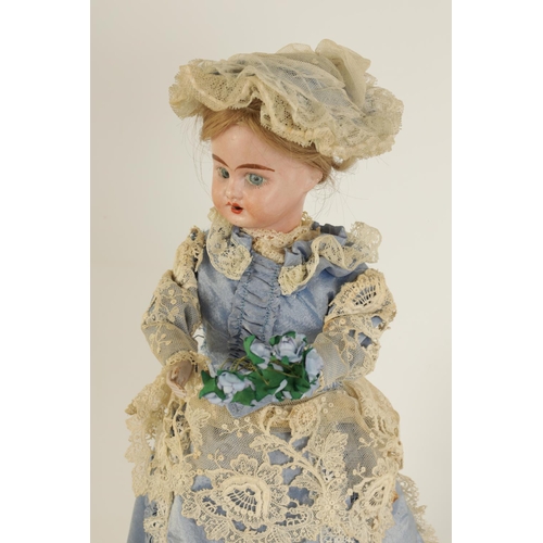 580 - A LATE 19TH CENTURY FRENCH MUSICAL AUTOMATON DOLL with moving bisque head and arms wearing a lacewor... 