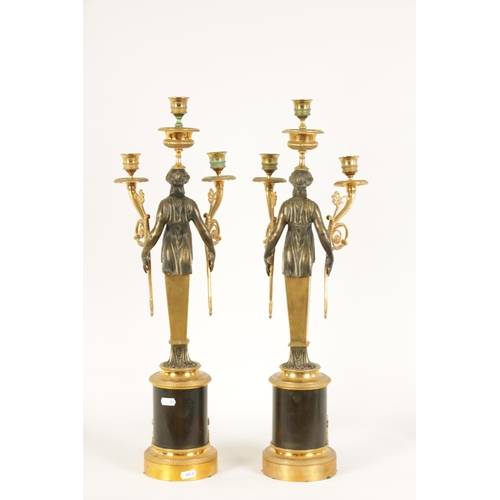 582 - A PAIR OF LATE 19TH CENTURY BRONZE AND ORMOLU FRENCH EMPIRE STYLE THREE BRANCH FIGURAL CANDELABRA wi... 