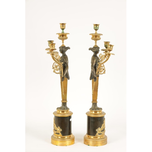 582 - A PAIR OF LATE 19TH CENTURY BRONZE AND ORMOLU FRENCH EMPIRE STYLE THREE BRANCH FIGURAL CANDELABRA wi... 