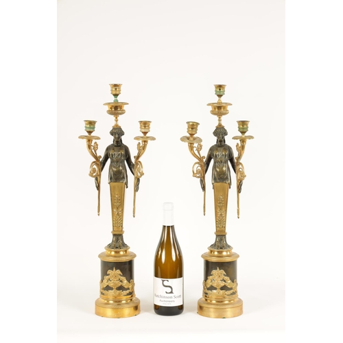 582 - A PAIR OF LATE 19TH CENTURY BRONZE AND ORMOLU FRENCH EMPIRE STYLE THREE BRANCH FIGURAL CANDELABRA wi... 