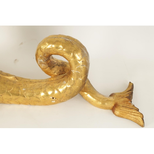 583 - A SET OF SIX REGENCY CARVED GILT GESSO CURTAIN POLE BRACKETS formed as dolphins. (46cm high )