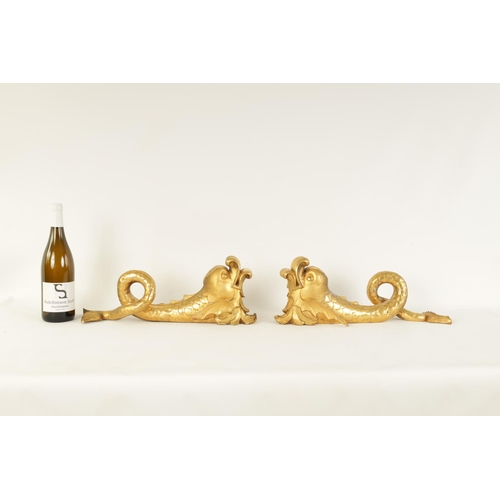 583 - A SET OF SIX REGENCY CARVED GILT GESSO CURTAIN POLE BRACKETS formed as dolphins. (46cm high )