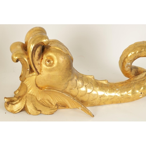 583 - A SET OF SIX REGENCY CARVED GILT GESSO CURTAIN POLE BRACKETS formed as dolphins. (46cm high )