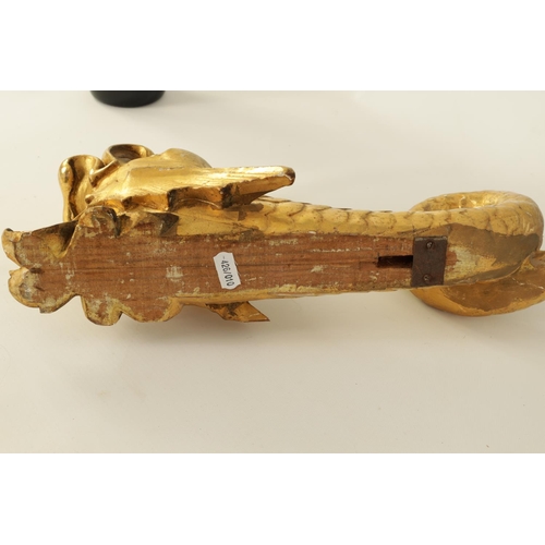 583 - A SET OF SIX REGENCY CARVED GILT GESSO CURTAIN POLE BRACKETS formed as dolphins. (46cm high )