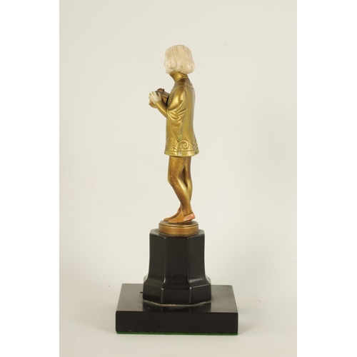 585 - FERDINAND PREISS (1882-1943). AN ART DECO GILT BRONZE AND IVORY FIGURE depicting a young boy holding... 