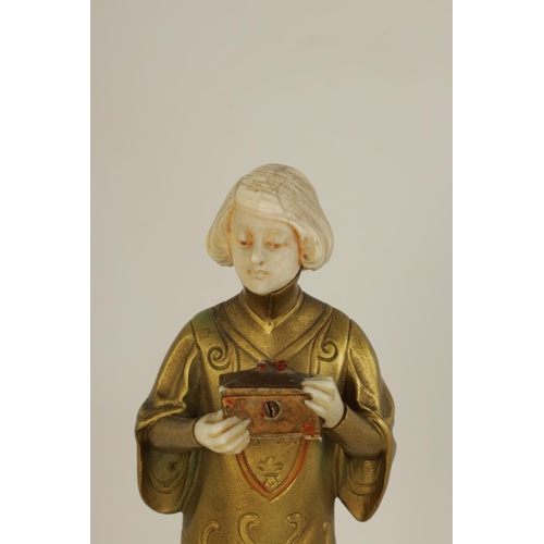 585 - FERDINAND PREISS (1882-1943). AN ART DECO GILT BRONZE AND IVORY FIGURE depicting a young boy holding... 