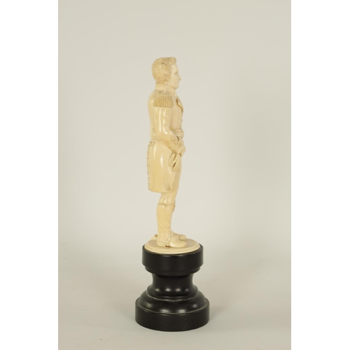 587 - A FINE 19TH CENTURY CARVED IVORY FIGURE OF THE DUKE OF WELLINGTON standing on a ebonised turned base... 