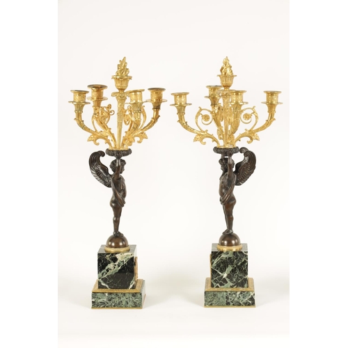 588 - A FINE PAIR OF LATE 19TH CENTURY BRONZE AND ORMOLU FRENCH EMPIRE STYLE FOUR BRANCH CANDELABRA the gi... 