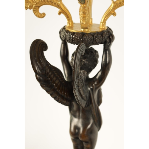 588 - A FINE PAIR OF LATE 19TH CENTURY BRONZE AND ORMOLU FRENCH EMPIRE STYLE FOUR BRANCH CANDELABRA the gi... 