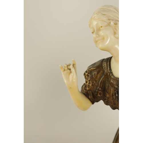 595 - PAUL PHILIPPE (1870 - 1930) AN ART DECO PATINATED BRONZE AND IVORY FIGURE OF A YOUNG LADY finely car... 