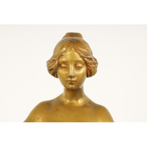 599 - MAURICE BOUVAL (1863-1916) AN ART NOUVEAU GILT AND SILVERED BRONZE FIGURE depiciting a young female ... 