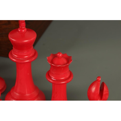 602 - A JACQUES & SONS STAUNTON PATTERN NEUTRAL AND RED STAINED IVORY CLUB SIZE CHESS SET in a fitted rose... 