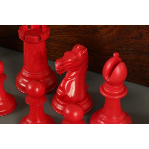 602 - A JACQUES & SONS STAUNTON PATTERN NEUTRAL AND RED STAINED IVORY CLUB SIZE CHESS SET in a fitted rose... 