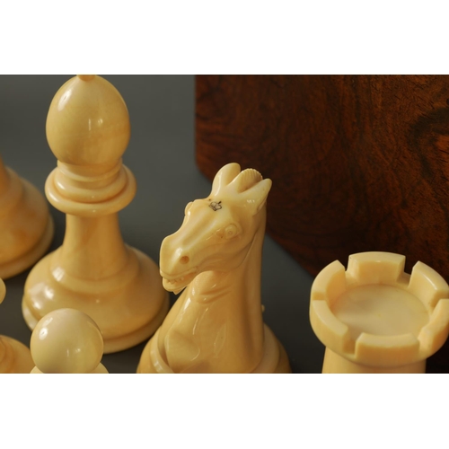 602 - A JACQUES & SONS STAUNTON PATTERN NEUTRAL AND RED STAINED IVORY CLUB SIZE CHESS SET in a fitted rose... 