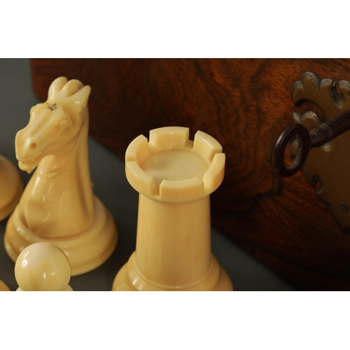 602 - A JACQUES & SONS STAUNTON PATTERN NEUTRAL AND RED STAINED IVORY CLUB SIZE CHESS SET in a fitted rose... 