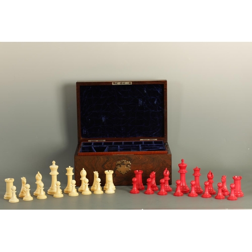 602 - A JACQUES & SONS STAUNTON PATTERN NEUTRAL AND RED STAINED IVORY CLUB SIZE CHESS SET in a fitted rose... 