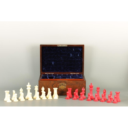 602 - A JACQUES & SONS STAUNTON PATTERN NEUTRAL AND RED STAINED IVORY CLUB SIZE CHESS SET in a fitted rose... 