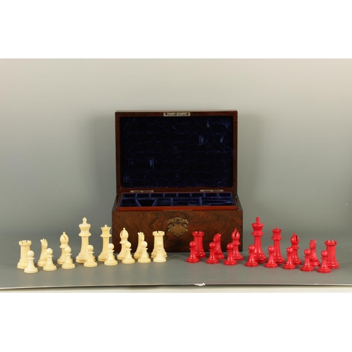 602 - A JACQUES & SONS STAUNTON PATTERN NEUTRAL AND RED STAINED IVORY CLUB SIZE CHESS SET in a fitted rose... 