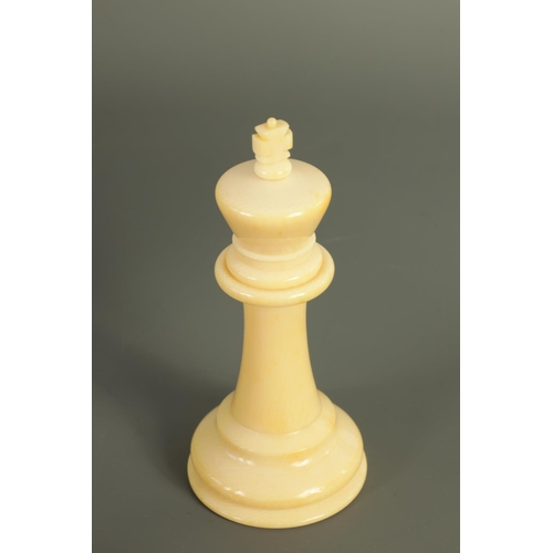 602 - A JACQUES & SONS STAUNTON PATTERN NEUTRAL AND RED STAINED IVORY CLUB SIZE CHESS SET in a fitted rose... 