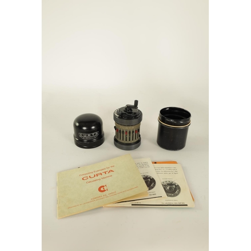 614 - A CURTA TYPE II CALCULATOR No. 523686 with original instruction booklets and metal case (11cm high)