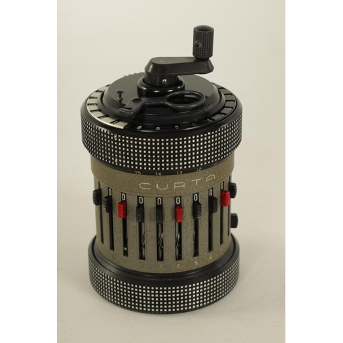 614 - A CURTA TYPE II CALCULATOR No. 523686 with original instruction booklets and metal case (11cm high)