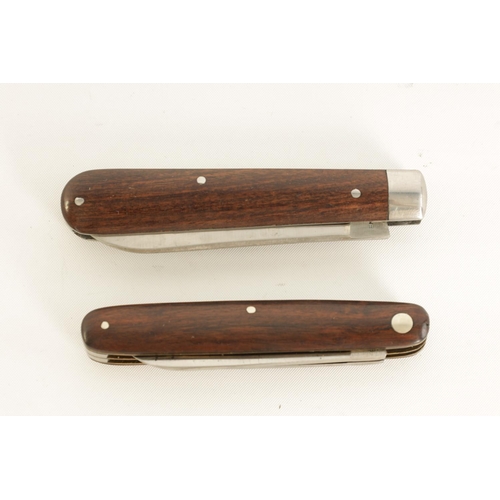 620 - TWO UNUSED JOSEPH RODGERS TWIN-BLADED FOLDING KNIVES with rosewood handles, the larger having the or... 