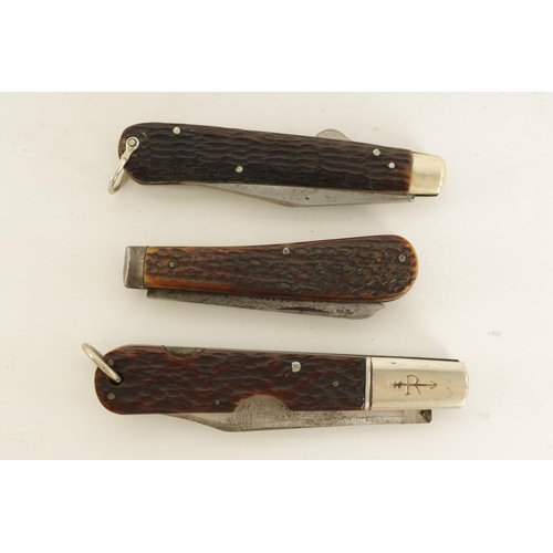 627 - A COLLECTION OF THREE FOLDING KNIVES WITH STAG HORN HANDLES a locking knife signed 'RUSSELL', a lock... 