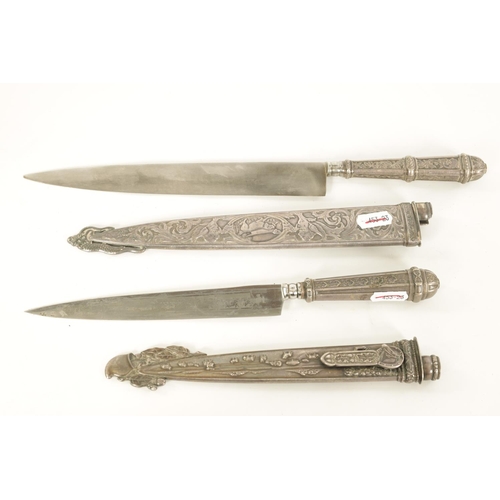 639 - TWO ARGENTINIAN SILVER GAUCHO KNIVES the larger with relief decoration depicting dogs within a carto... 