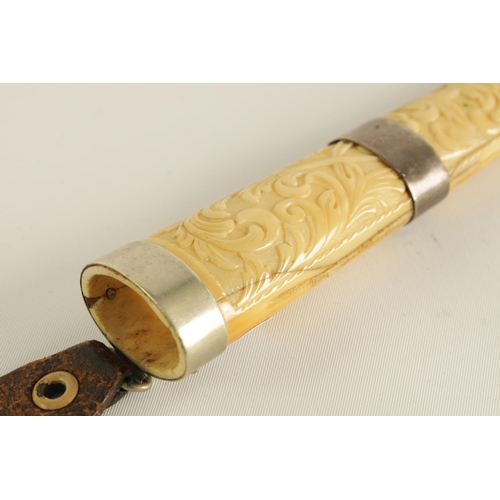 640 - A 19TH CENTURY NORWEGIAN WALRUS IVORY KNIFE with shaped handle and 8cm single edge steel blade, with... 