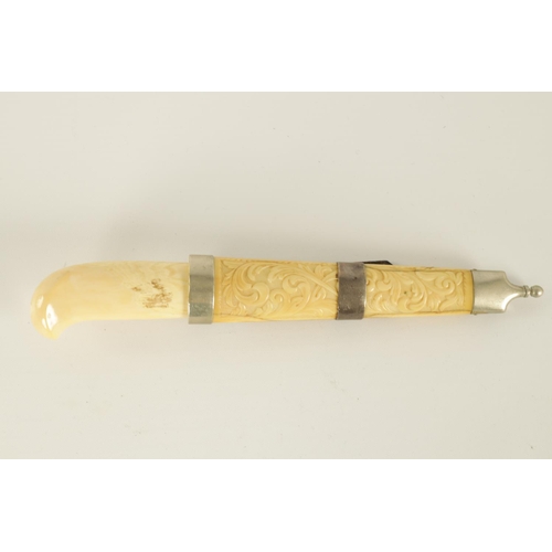 640 - A 19TH CENTURY NORWEGIAN WALRUS IVORY KNIFE with shaped handle and 8cm single edge steel blade, with... 