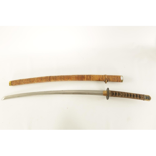 651 - AN EARLY 20TH CENTURY JAPANESE MILITARY SAMURAI KATANA SWORD the grip with cloth binding and gilt fl... 