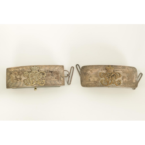 657 - TWO VICTORIAN SILVER MOUNTED OFFICER’S CROSS BELT POUCHES with engraved borders and mounted with a g... 