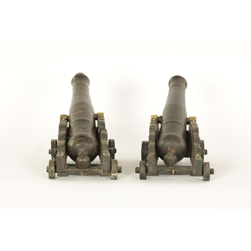 658 - A PAIR OF 19TH CENTURY CARVED WOOD CANNON MODELS modelled from the armour of Lord Nelson's HMS Victo... 