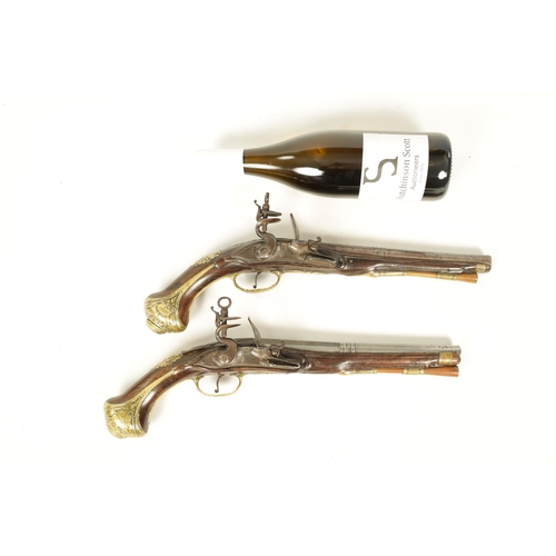 680 - I.H. DEOP, RIPOLL. A PAIR OF 18TH CENTURY BRASS MOUNTED SPANISH FLINTLOCK PISTOLS each fitted a two-... 