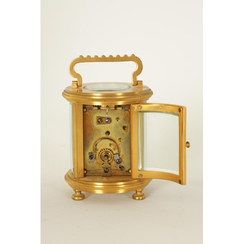 686 - A LATE 19TH CENTURY GILT BRASS FRENCH MINIATURE CYLINDRICAL CARRIAGE CLOCK the engine-turned masked ... 