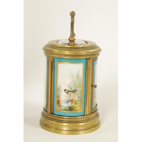 690 - A LATE 19TH CENTURY FRENCH OVAL MINIATURE PORCELAIN PANELLED CARRIAGE CLOCK the moulded brass case e... 