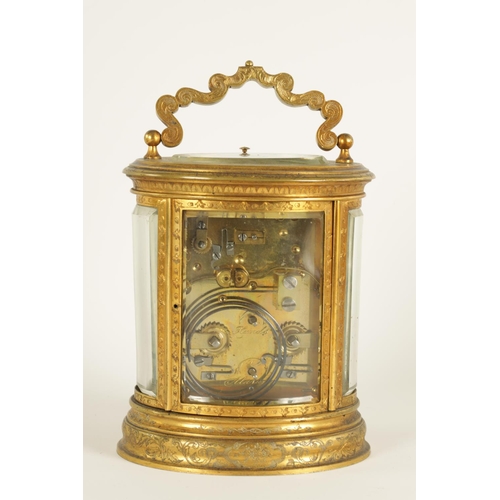 691 - A LATE 19TH CENTURY OVAL ENGRAVED GILT BRASS CARRIAGE CLOCK REPEATER the foliate engraved case enclo... 