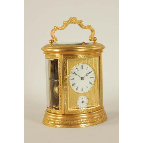 696 - A LATE 19TH CENTURY OVAL ENGRAVED GILT BRASS REPEATING CARRIAGE CLOCK the foliate engraved case encl... 