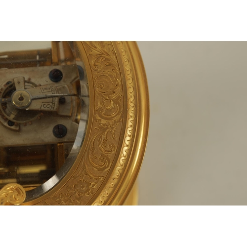 696 - A LATE 19TH CENTURY OVAL ENGRAVED GILT BRASS REPEATING CARRIAGE CLOCK the foliate engraved case encl... 