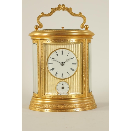 696 - A LATE 19TH CENTURY OVAL ENGRAVED GILT BRASS REPEATING CARRIAGE CLOCK the foliate engraved case encl... 