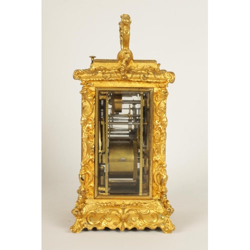 712 - A FINE MID 19TH CENTURY GILT BRASS FRENCH ROCOCO REPEATING CARRIAGE CLOCK WITH ALARM OF SMALL SIZE -... 