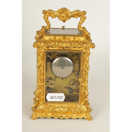 712 - A FINE MID 19TH CENTURY GILT BRASS FRENCH ROCOCO REPEATING CARRIAGE CLOCK WITH ALARM OF SMALL SIZE -... 