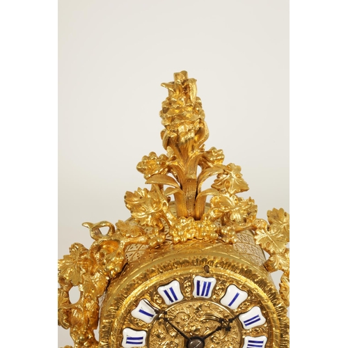 718 - A SMALL MID 19TH CENTURY FRENCH ORMOLU MANTLE CLOCK the Rococo style case with leaf and berry decora... 