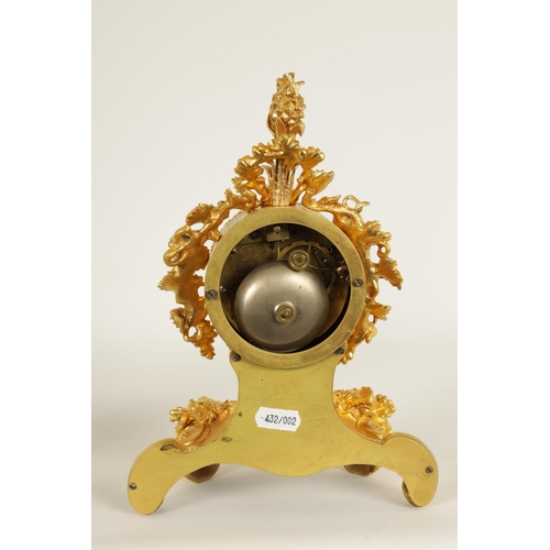 718 - A SMALL MID 19TH CENTURY FRENCH ORMOLU MANTLE CLOCK the Rococo style case with leaf and berry decora... 