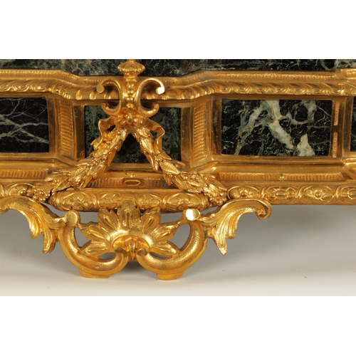 821 - A LATE 19TH CENTURY FRENCH FIGURAL OMOLU AND VERDI ANTICO MARBLE MANTLE CLOCK the case surmounted by... 