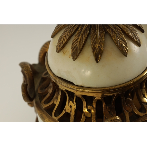 562 - A PAIR OF 19TH CENTURY CARRARA MARBLE AND ORMOLU MOUNTED CASOLETTES with detachable finials, peirced... 